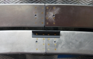 The F-631E plates and the F-732D bracket get riveted to the frame halves first.