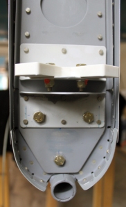 Three bolts connect the lower portion of the vertical stabilizer to the fuselage and tailwheel mount.